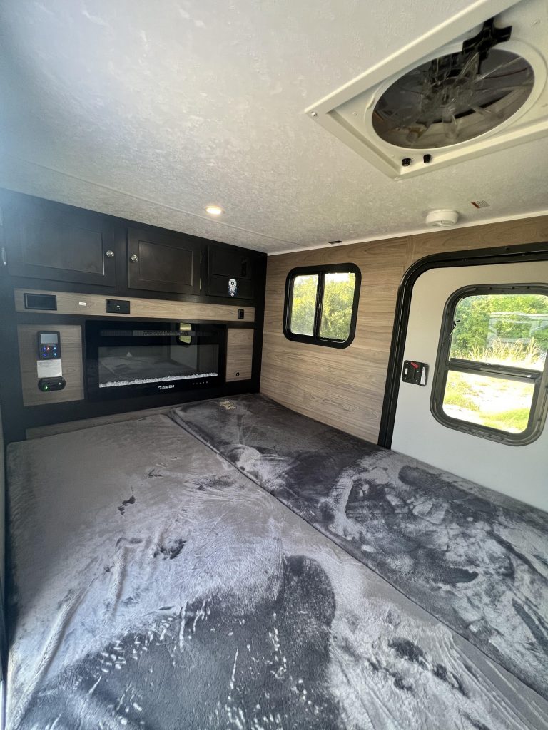 Interior of Bushwhacker 12 ROK with fireplace and storage