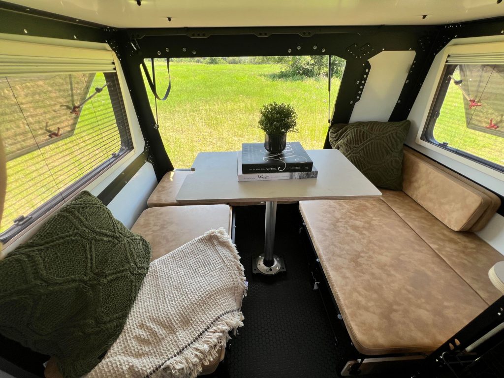 Dinette with open rear hatch in 2023 TAXA Mantis